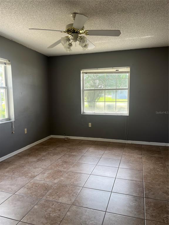 1585 Triangle Drive Mount Dora, FL 32757 - Photo 12 of 19 a view of an empty room with a window