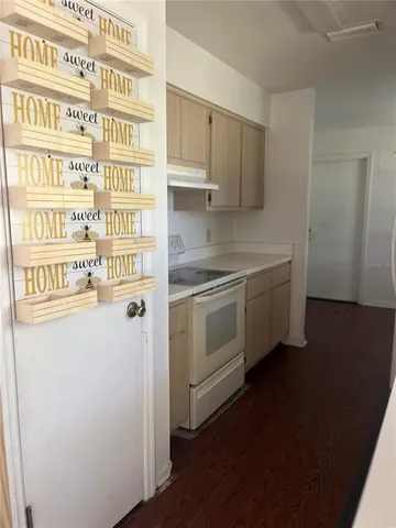a view of a kitchen with a sink and dishwasher