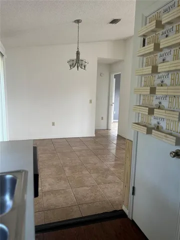 a kitchen with a sink stove and refrigerator