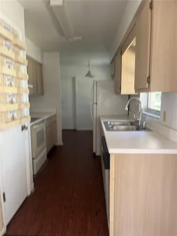 an empty room with a ceiling fan and window