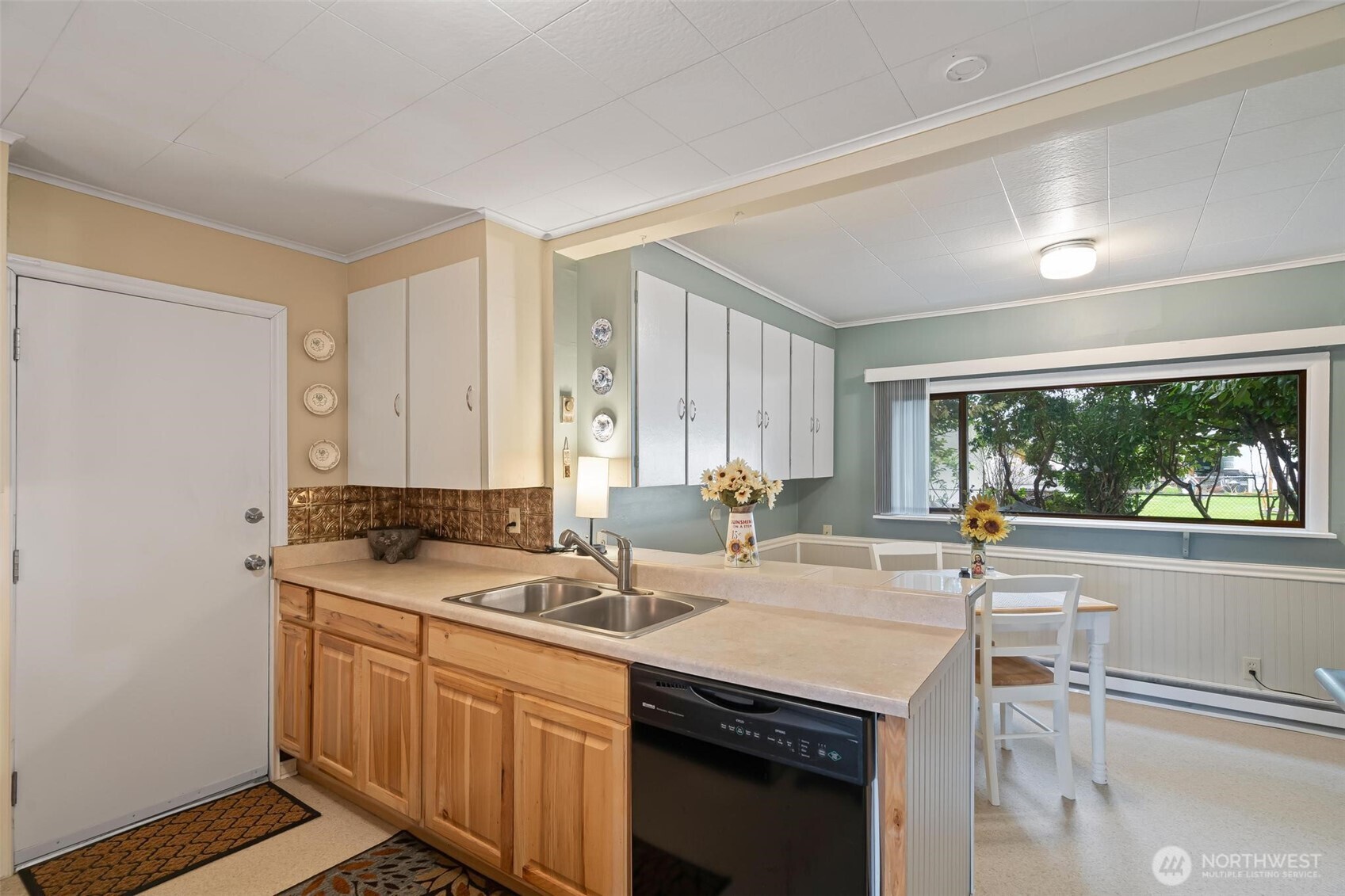 211 30th Street Hoquiam, WA 98550 - Photo 8 of 24 a kitchen with a sink stove and cabinets