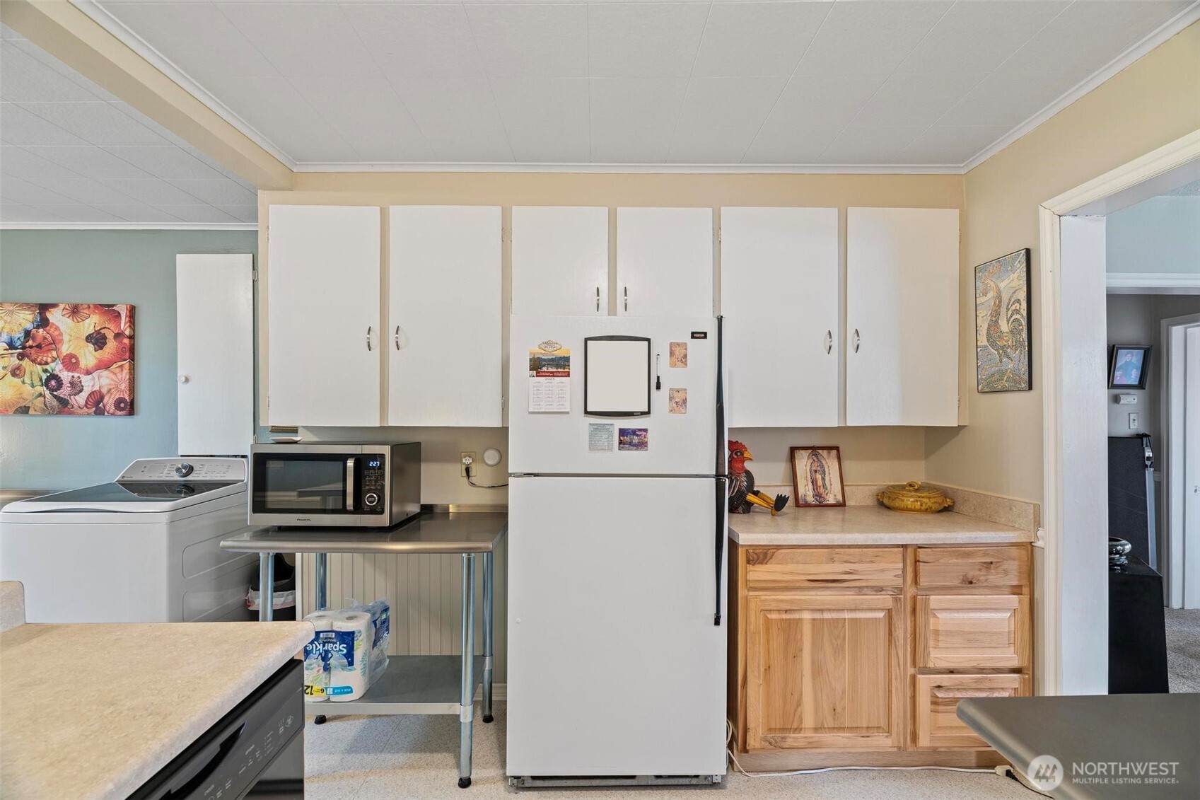 211 30th Street Hoquiam, WA 98550 - Photo 9 of 24 a kitchen with stainless steel appliances granite countertop a refrigerator sink and stove