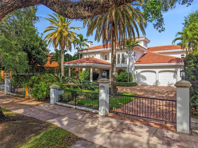 a front view of house with small garden
