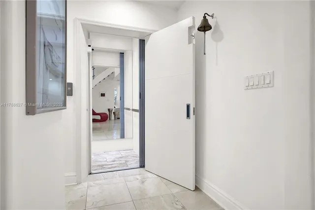 a view of a bathroom from a hallway