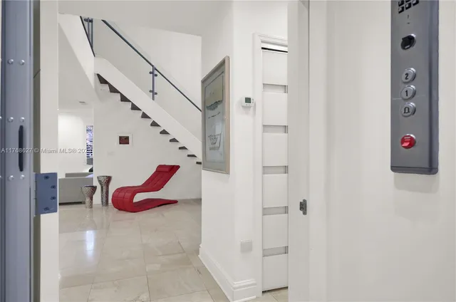 a view of an entryway with dining room and stairs