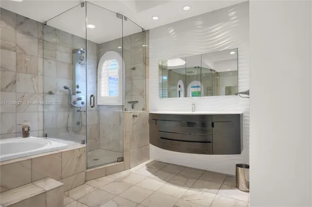 a spacious bathroom with a shower a sink and a mirror