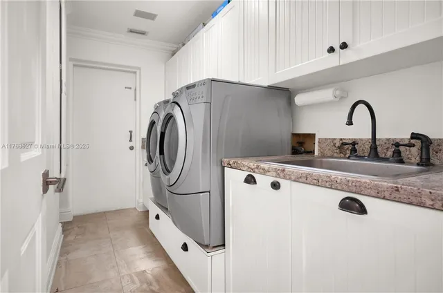 a utility room with cabinets