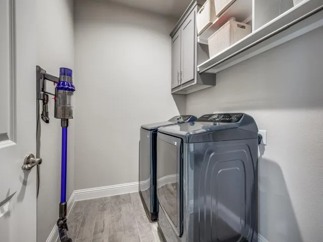 a utility room with dryer and washer