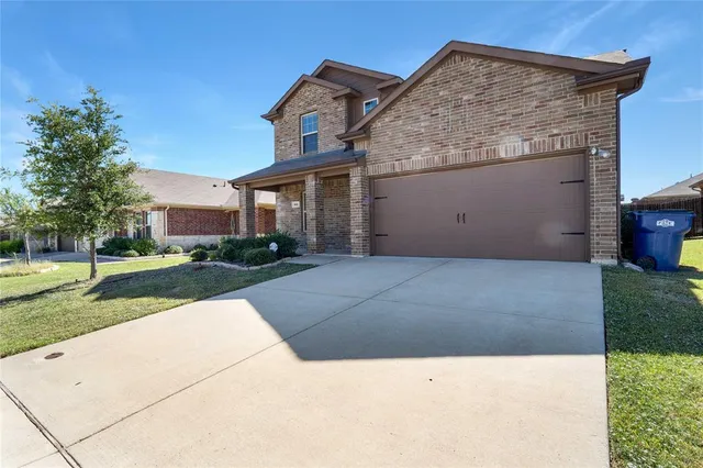 an aerial view of a swimming pool with outdoor seating