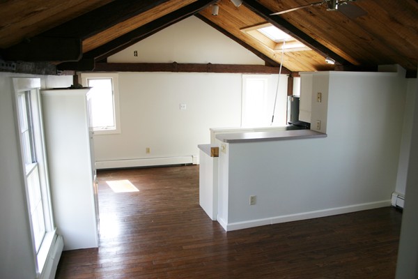 526 Centre Street, Unit 3 Boston, MA 02130 - Photo 6 of 15 a view of a refrigerator in kitchen and wooden floor