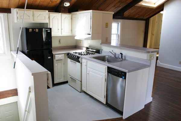 526 Centre Street, Unit 3 Boston, MA 02130 - Photo 8 of 15 a kitchen with a sink stove and refrigerator