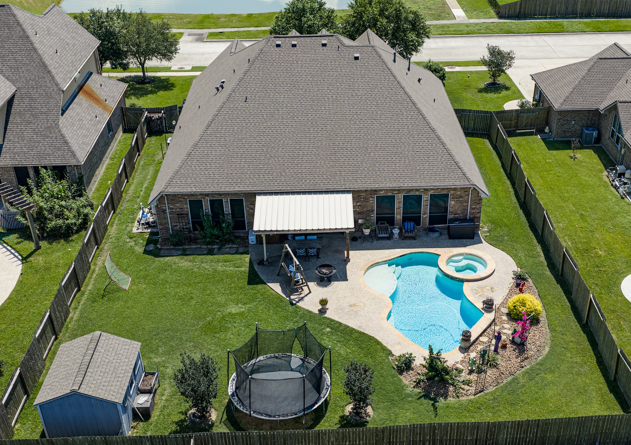 1283 Laurel Lane Angleton, TX 77515 - Photo 2 of 40 Back Yard Oasis! Heated Pool & Hot Tub. Plenty of Green Space