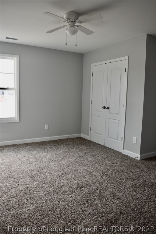 263 McMillan Siding Road Parkton, NC 28371 - Photo 12 of 15 an empty room with a ceiling fan and window