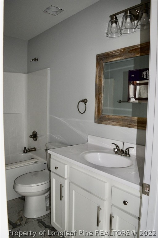263 McMillan Siding Road Parkton, NC 28371 - Photo 14 of 15 a bathroom with a sink toilet and mirror