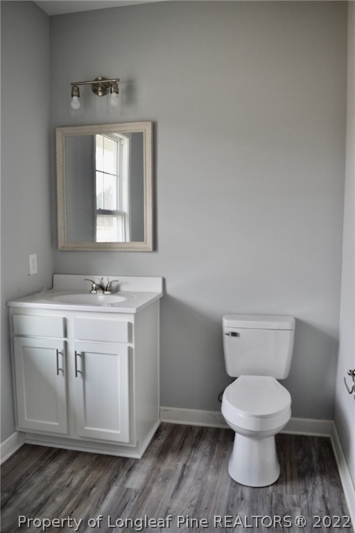 263 McMillan Siding Road Parkton, NC 28371 - Photo 5 of 15 a white toilet sitting next to a bathroom sink