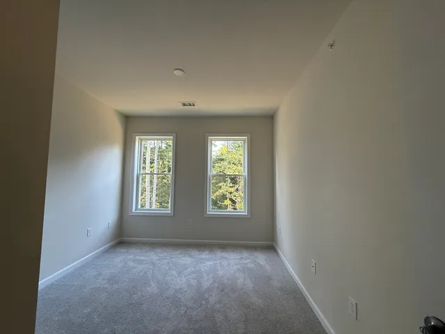 a bathroom with a double vanity sink and mirror