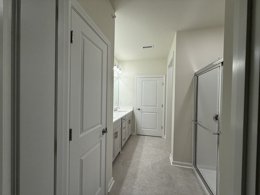 4 Winslow Lane, Unit 1411 North Grafton, MA 01536 - Photo 29 of 36 a view of a bathroom from the hallway