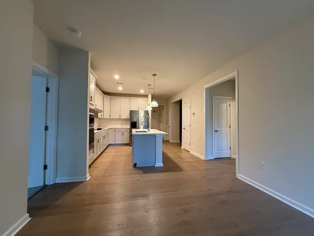 a spacious bathroom with a double vanity sink and mirror