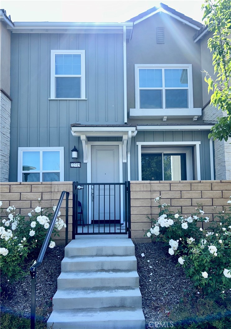 22715 Harmony Drive Saugus, CA 91350 - Photo 1 of 1 a front view of a house with a garden