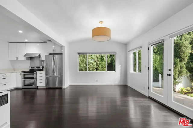a view of kitchen with wooden floor and window