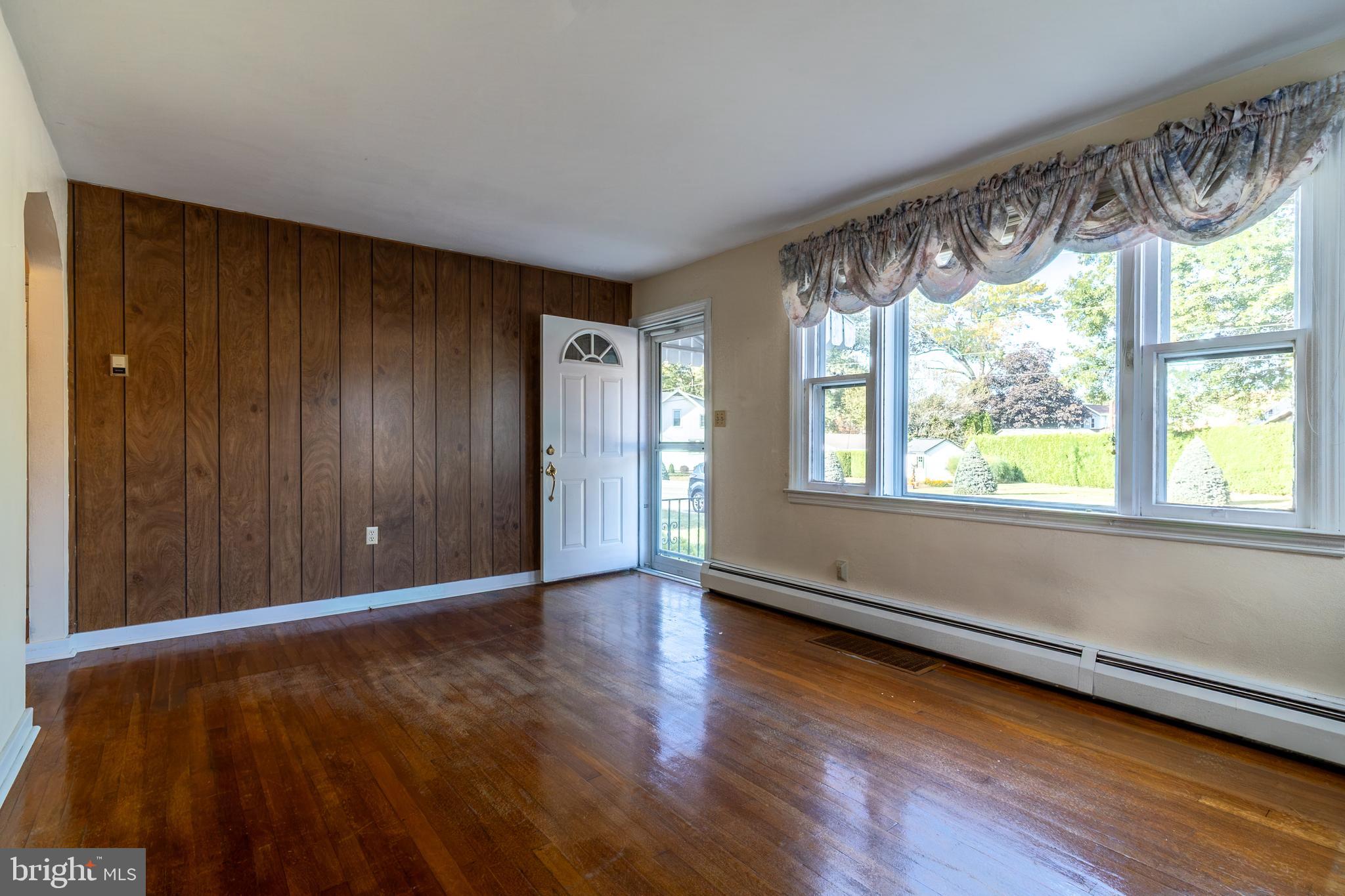 129 South Mill Street Lebanon, PA 17042 - Photo 3 of 17 Bright Living Room w/ original hardwood floors