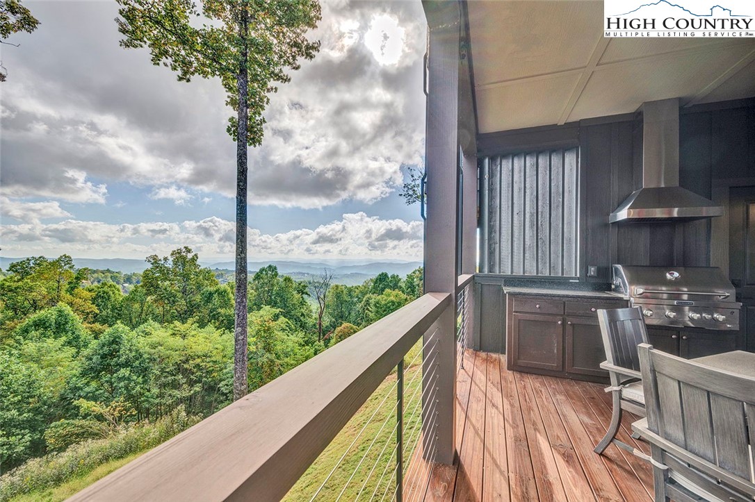 188 Ramblestone Terrace, Unit 101 Boone, NC 28607 - Photo 18 of 48 a view of a balcony with chairs