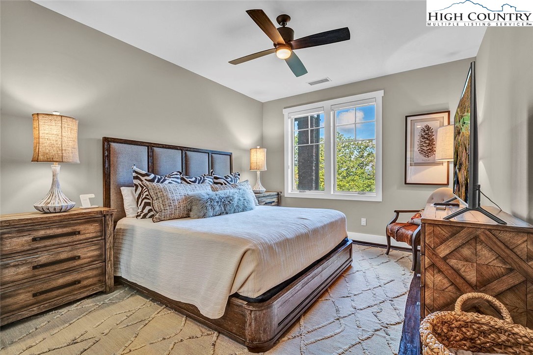 188 Ramblestone Terrace, Unit 101 Boone, NC 28607 - Photo 21 of 48 a bedroom with a bed and window