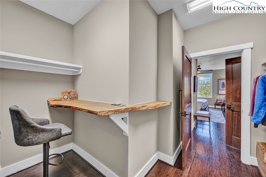 188 Ramblestone Terrace, Unit 101 Boone, NC 28607 - Photo 25 of 48 a view of a hallway with furniture and wooden floor