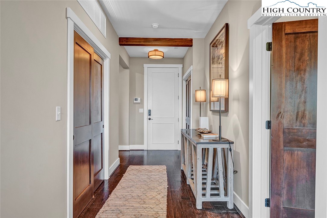 188 Ramblestone Terrace, Unit 101 Boone, NC 28607 - Photo 5 of 48 a view of a hallway with wooden floor and entryway