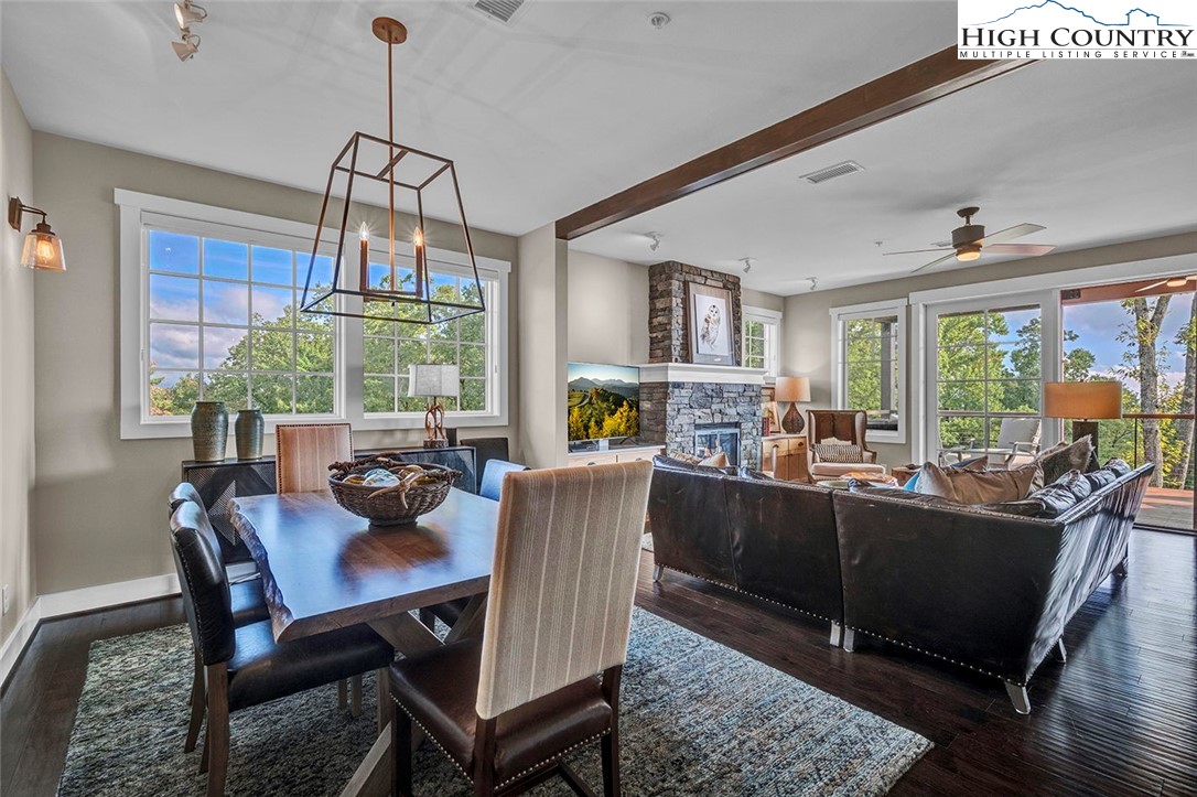 188 Ramblestone Terrace, Unit 101 Boone, NC 28607 - Photo 6 of 48 a dining room with furniture a chandelier and window