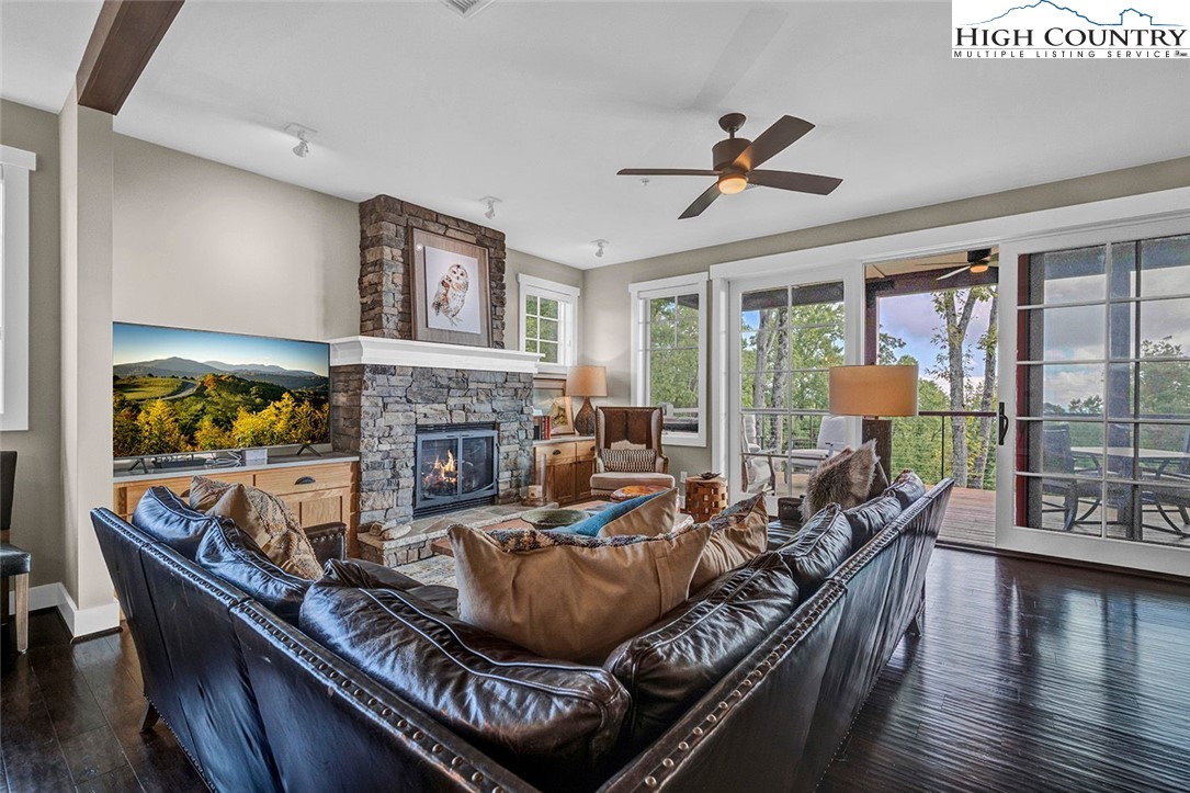 188 Ramblestone Terrace, Unit 101 Boone, NC 28607 - Photo 9 of 48 a living room with furniture fireplace and wooden floor