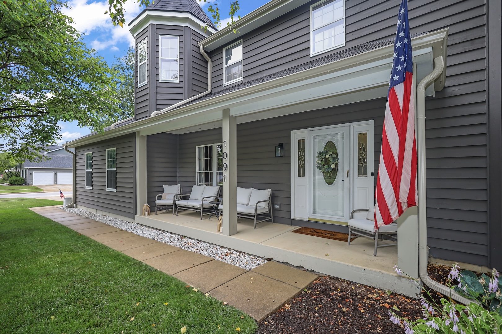 a front view of a house with garden