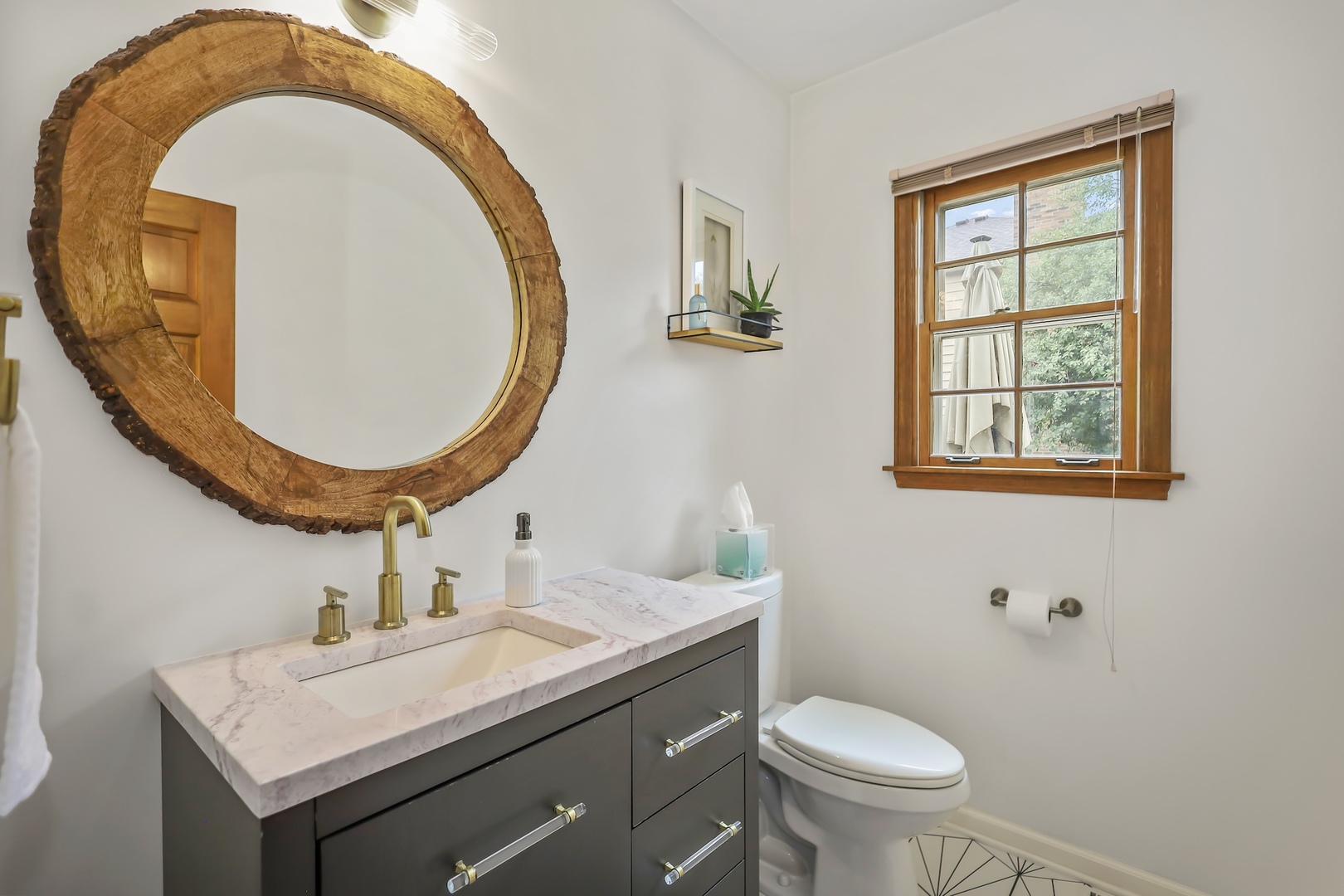 1091 Danforth Drive Batavia, IL 60510 - Photo 16 of 40 a bathroom with a sink a mirror a toilet and a window