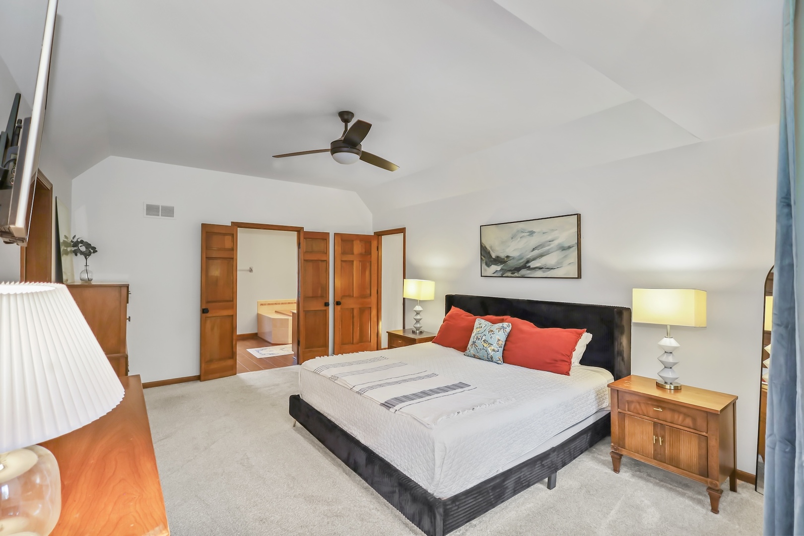 1091 Danforth Drive Batavia, IL 60510 - Photo 18 of 40 a bedroom with a large bed and a chandelier