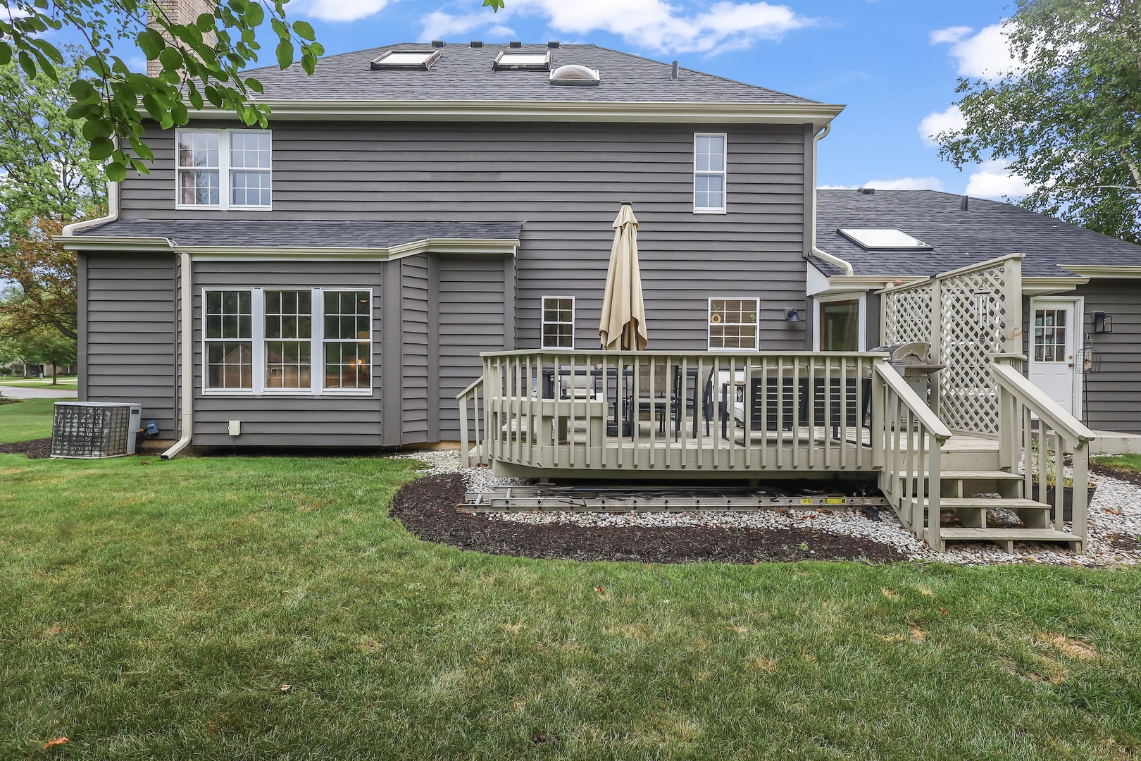 1091 Danforth Drive Batavia, IL 60510 - Photo 32 of 40 a view of a house with a yard and deck