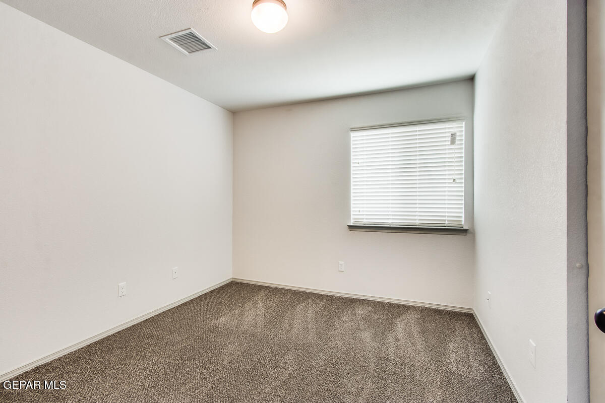 12420 Oconee Place Clint, TX 79836 - Photo 18 of 27 an empty room with a window