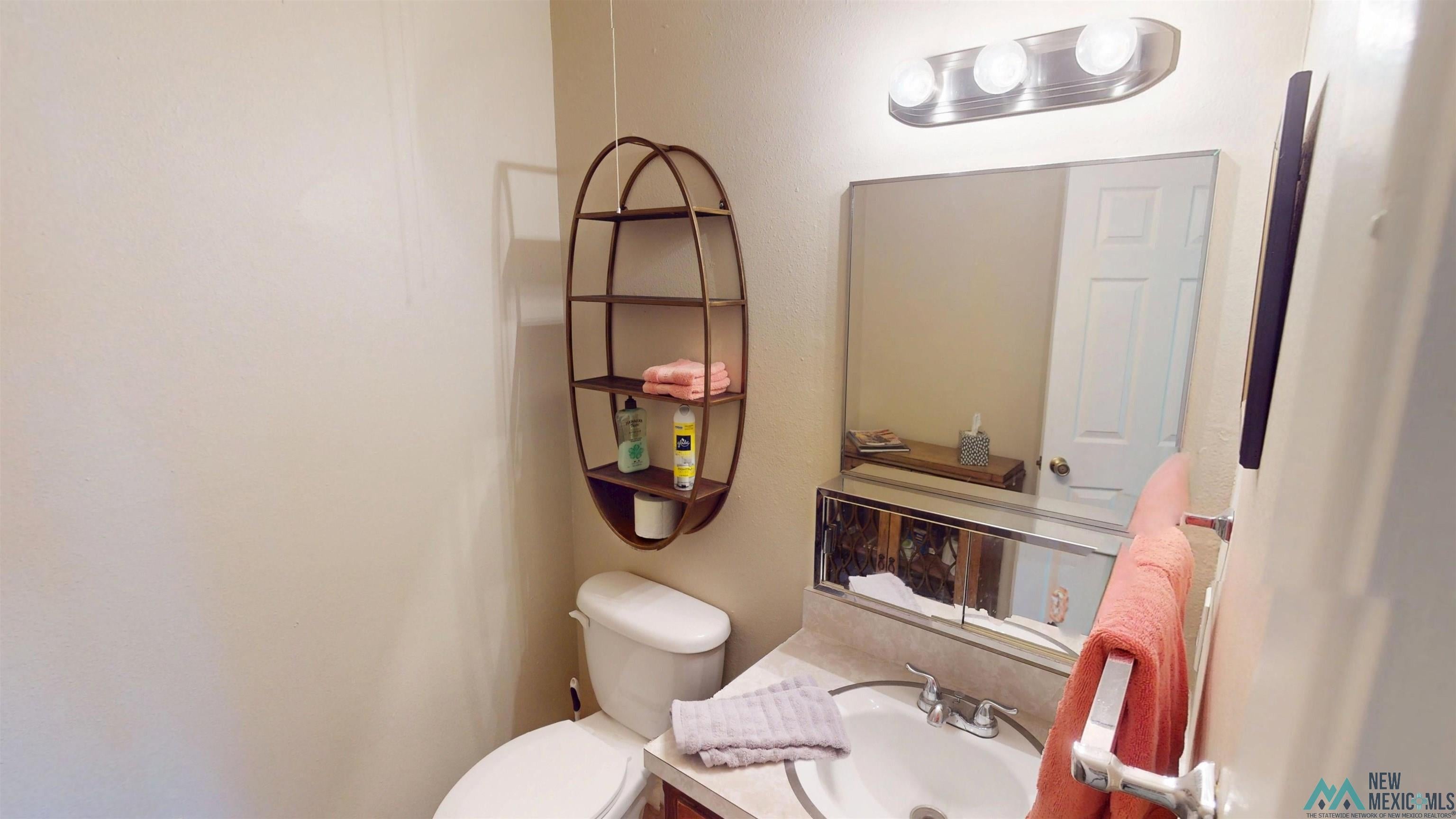 23 Pendaries Lane Rociada, NM 87742 - Photo 7 of 26 Bathroom featuring a vanity with a laminate countertop, undermount sink, and chrome faucet