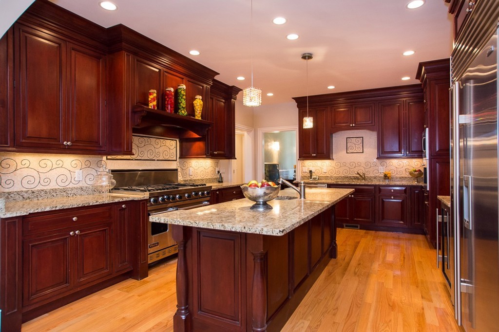 41 Cutler Lane Brookline, MA 02467 - Photo 2 of 12 a kitchen with a sink stove and cabinets