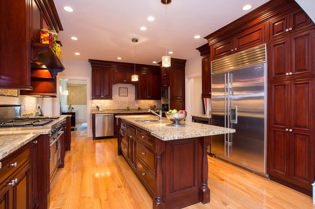 41 Cutler Lane Brookline, MA 02467 - Photo 3 of 12 a kitchen with stainless steel appliances granite countertop a sink a stove and a refrigerator