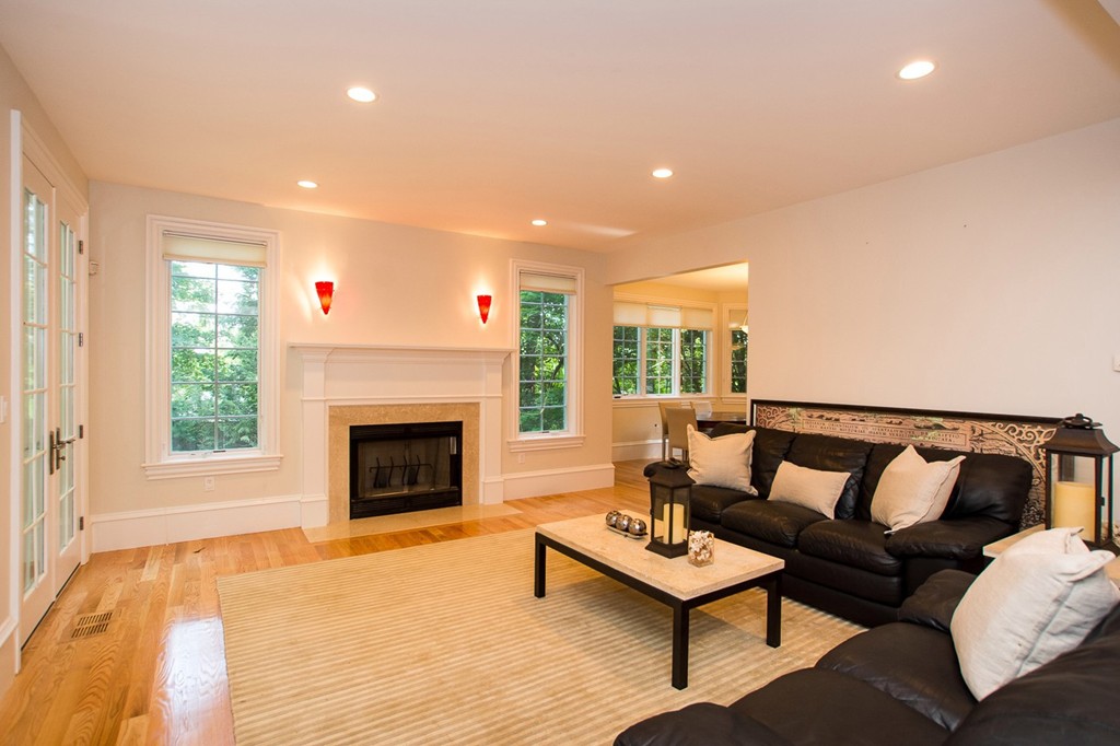 41 Cutler Lane Brookline, MA 02467 - Photo 7 of 12 a living room with furniture and a fireplace