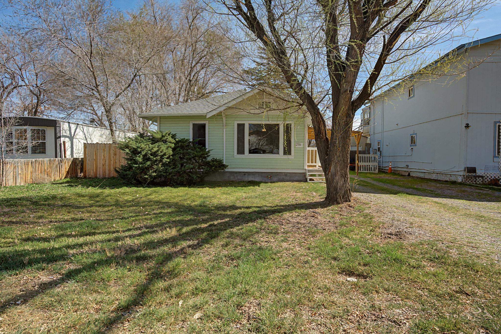 216 4th Street Clifton, CO 81520 - Photo 2 of 17 a view of a house with a yard