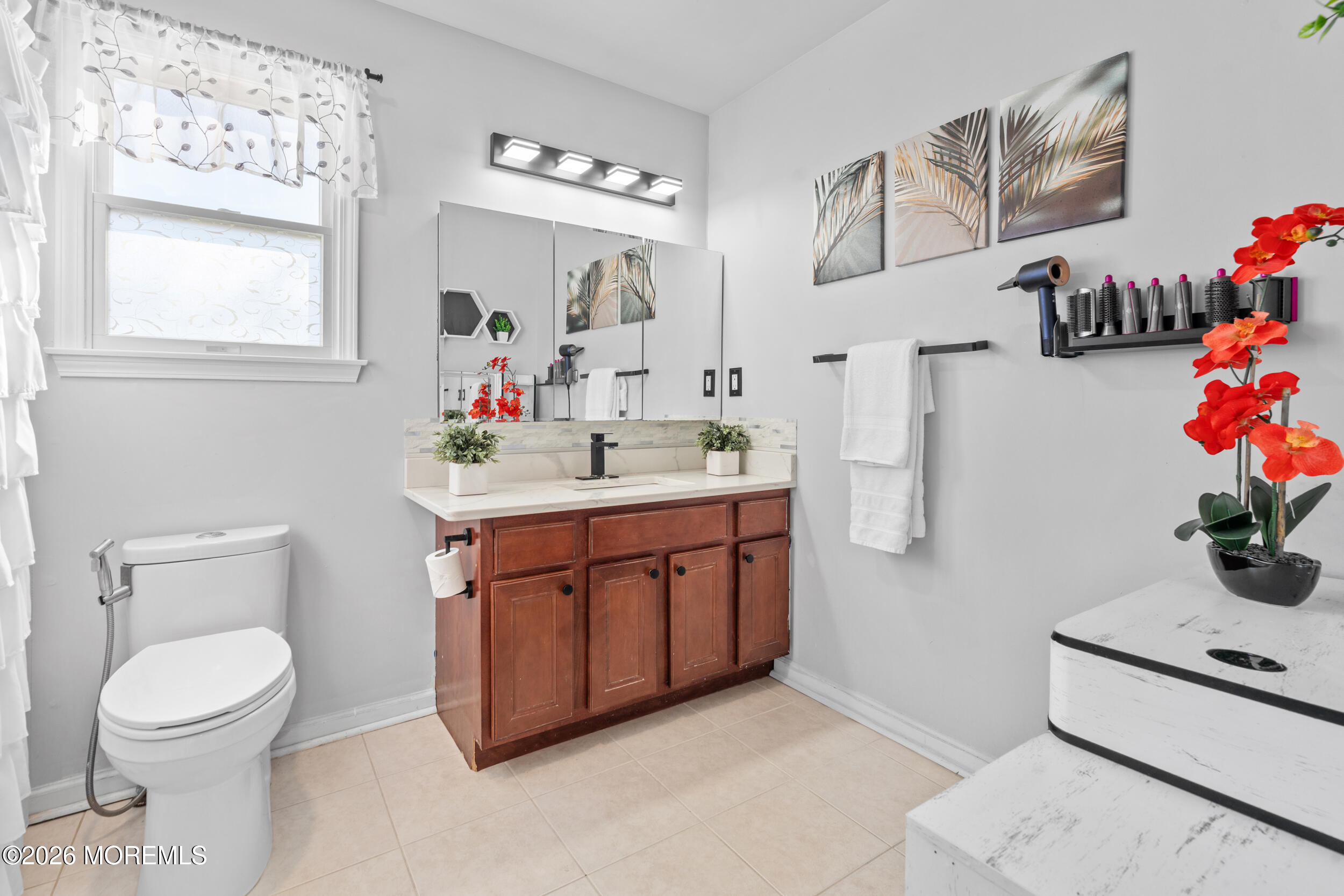 207 Lower Main Street Matawan, NJ 07747 - Photo 13 of 19 a bathroom with a toilet sink and mirror