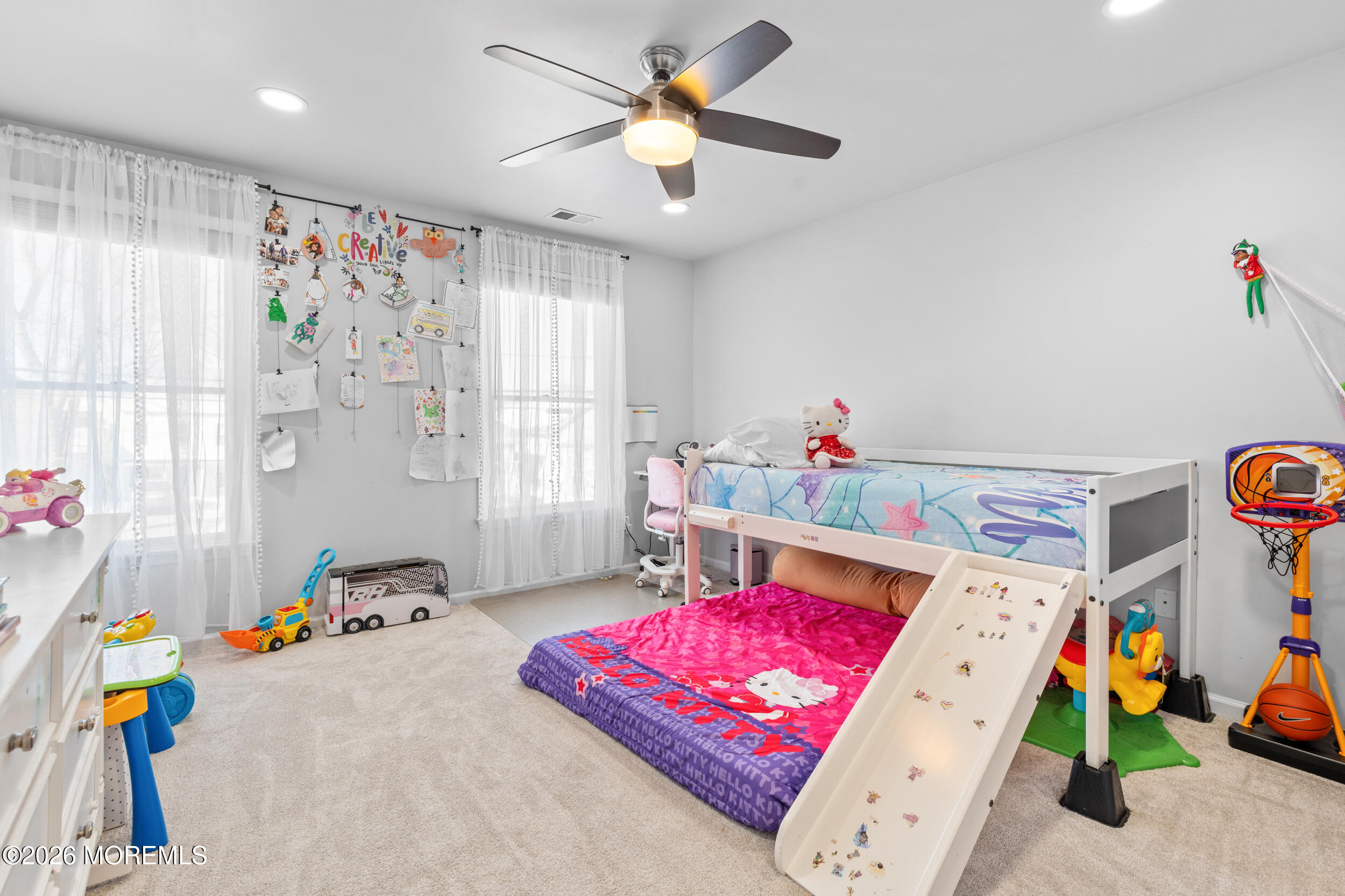 207 Lower Main Street Matawan, NJ 07747 - Photo 14 of 19 a living room with furniture a baby crib and a chandelier