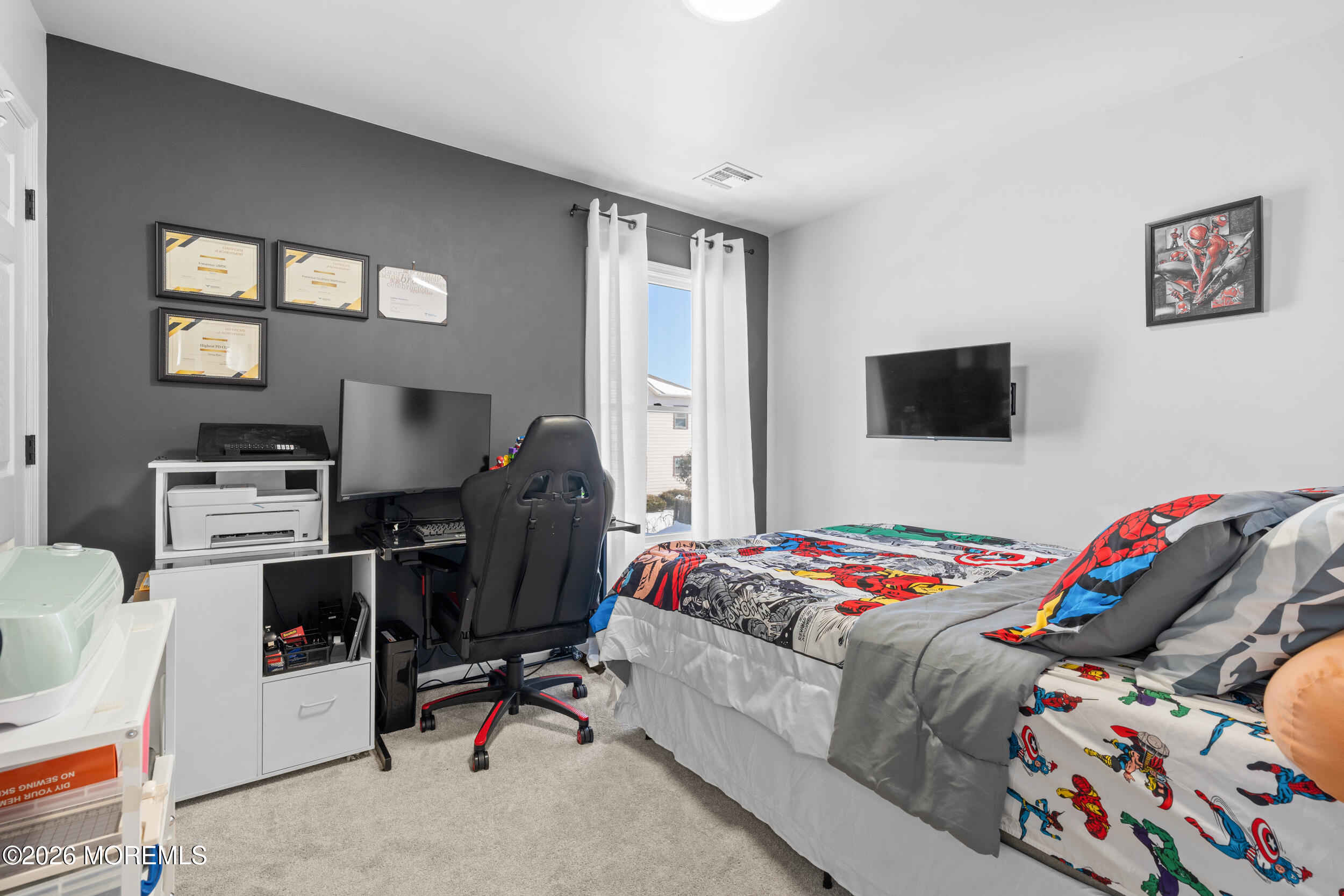 207 Lower Main Street Matawan, NJ 07747 - Photo 17 of 19 a bedroom with a bed and a flat screen tv