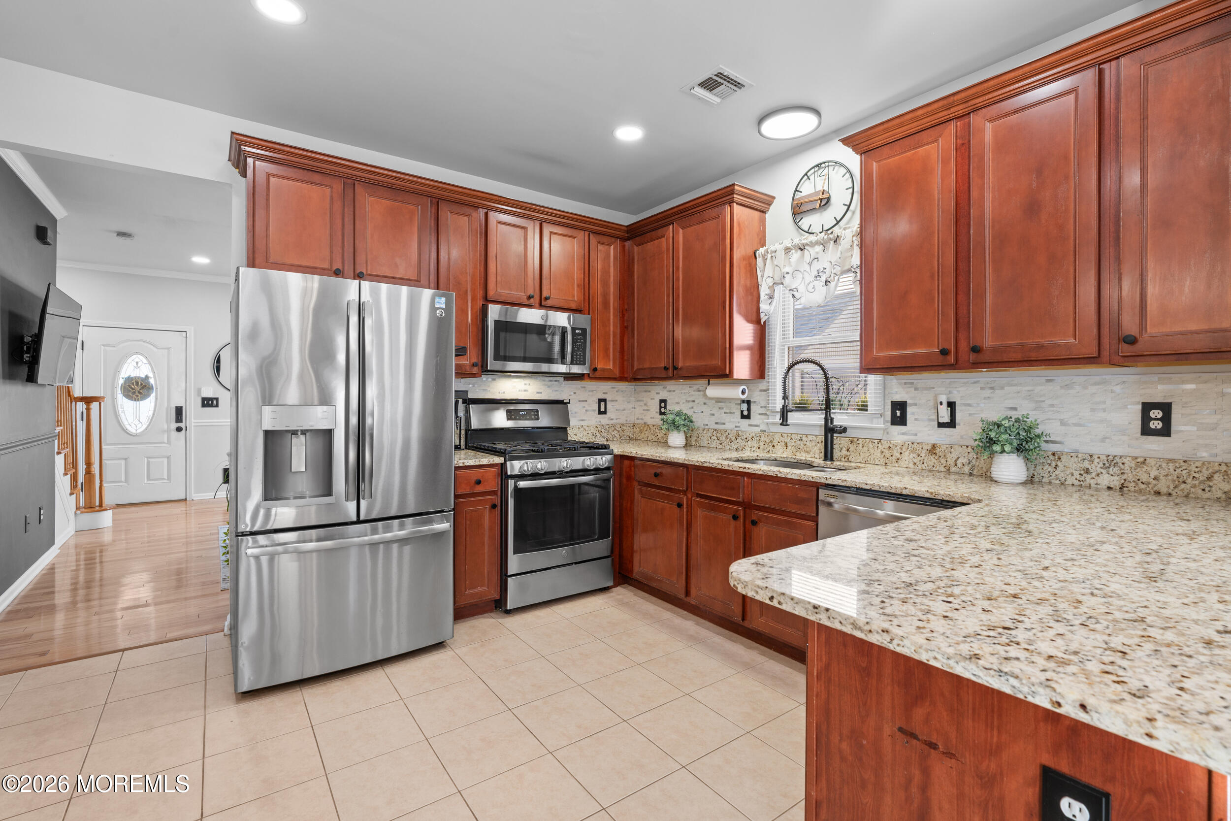207 Lower Main Street Matawan, NJ 07747 - Photo 3 of 19 a kitchen with granite countertop a refrigerator stove top oven and sink