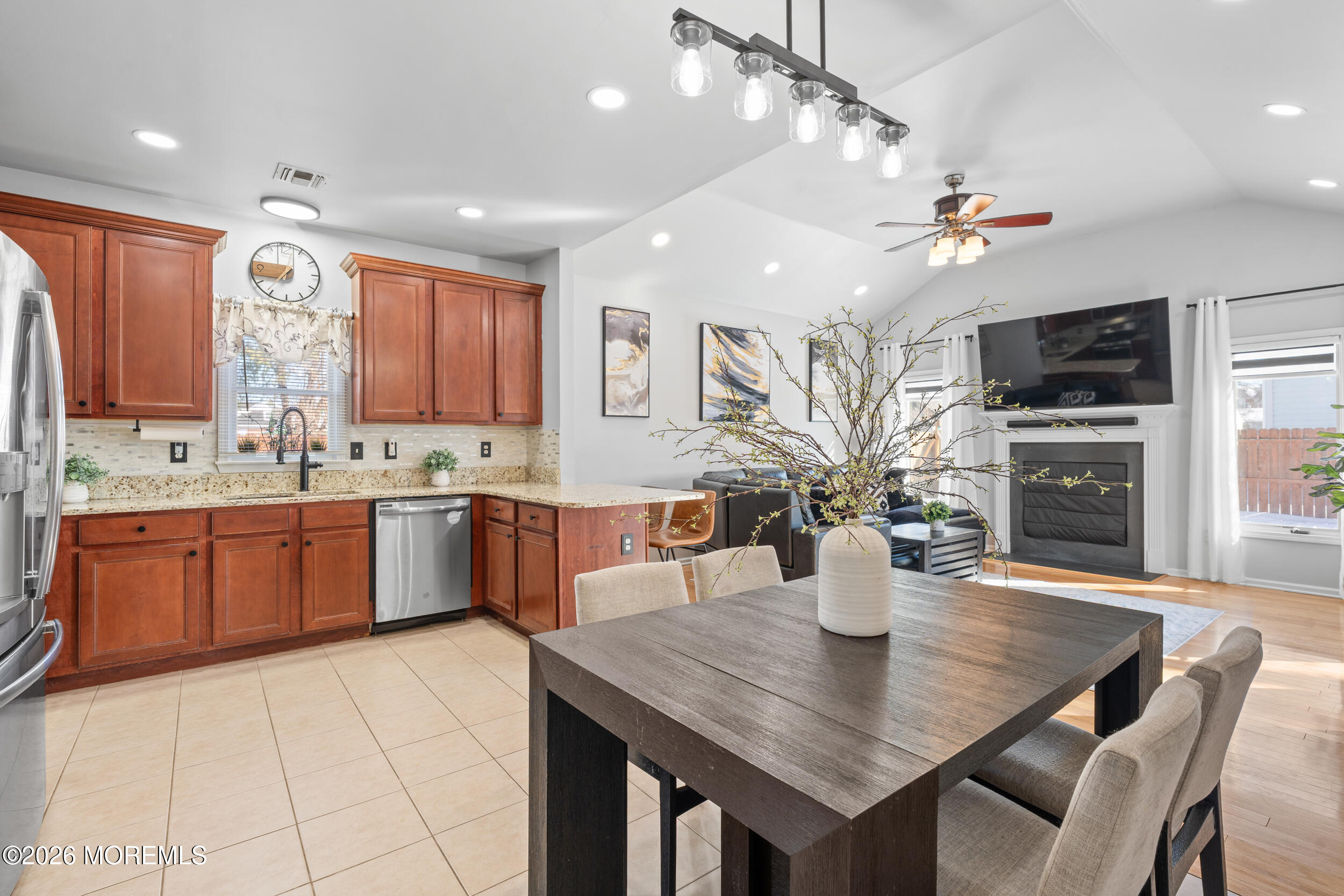 207 Lower Main Street Matawan, NJ 07747 - Photo 5 of 19 a kitchen with a table chairs sink and cabinets
