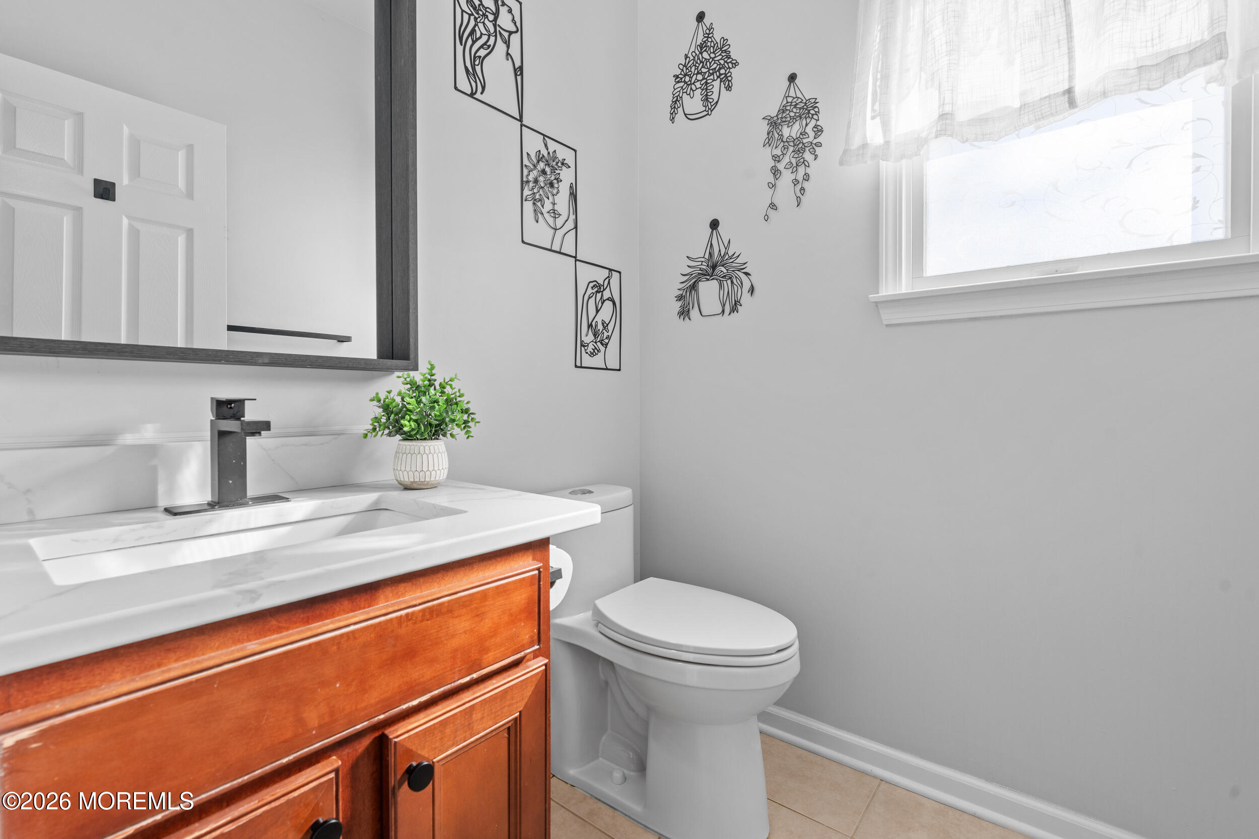 207 Lower Main Street Matawan, NJ 07747 - Photo 7 of 19 a bathroom with a granite countertop sink and a toilet