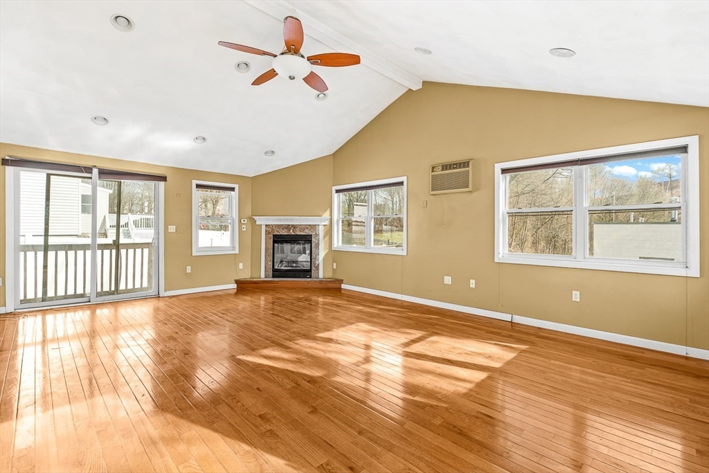 15 Tremont Street Stoneham, MA 02180 - Photo 24 of 38 a view of an empty room with a window and wooden floor