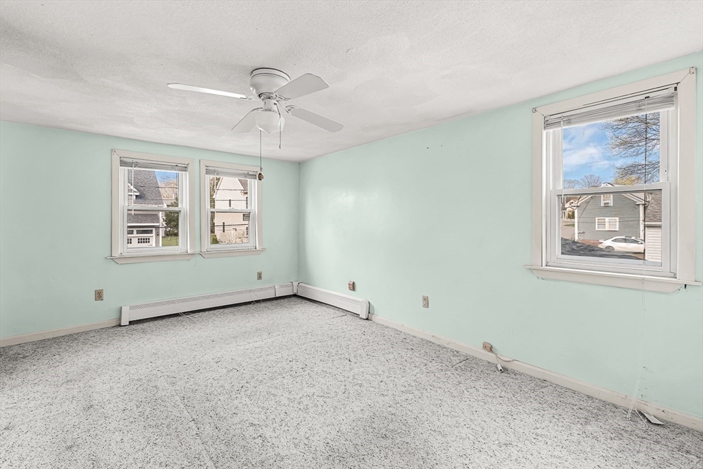 15 Tremont Street Stoneham, MA 02180 - Photo 27 of 38 a view of an empty room with a window