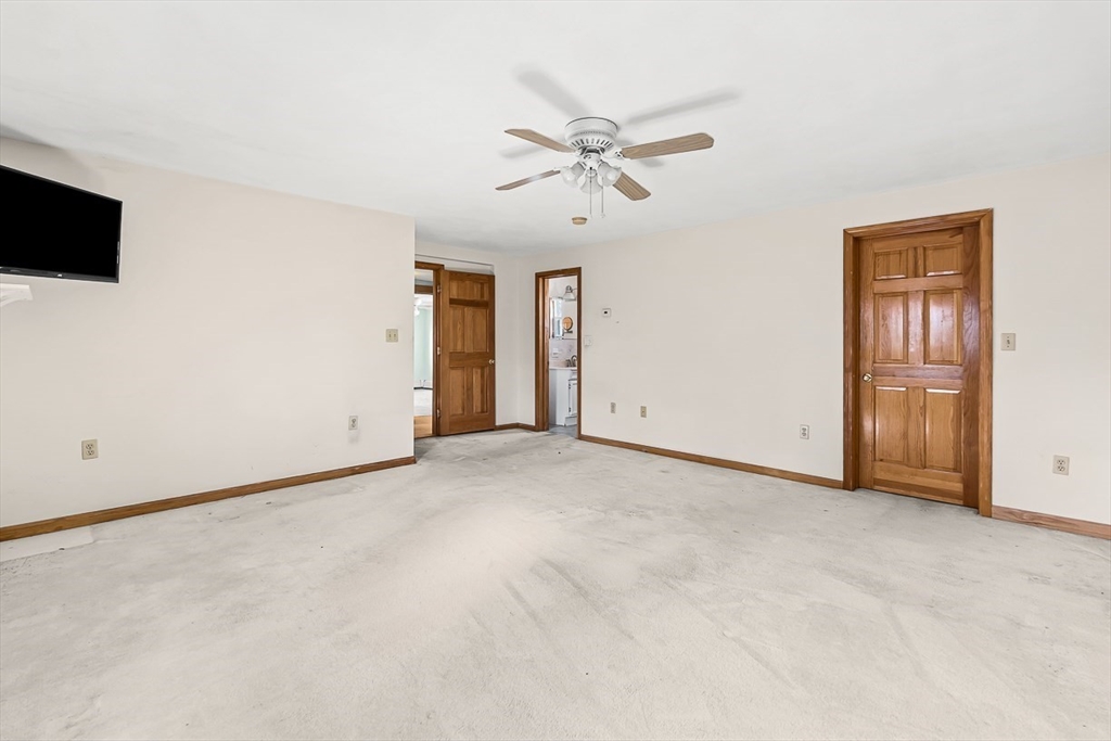 15 Tremont Street Stoneham, MA 02180 - Photo 33 of 38 a view of an empty room with a ceiling fan